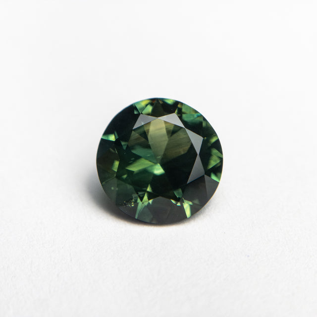 IN SHOP _ 1.76ct 7.30mm Round Brilliant Green/Teal Parti Sapphire