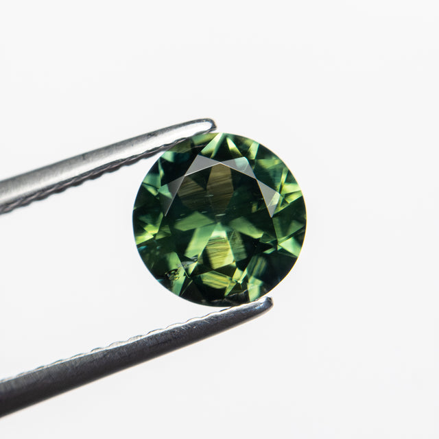 IN SHOP _ 1.76ct 7.30mm Round Brilliant Green/Teal Parti Sapphire