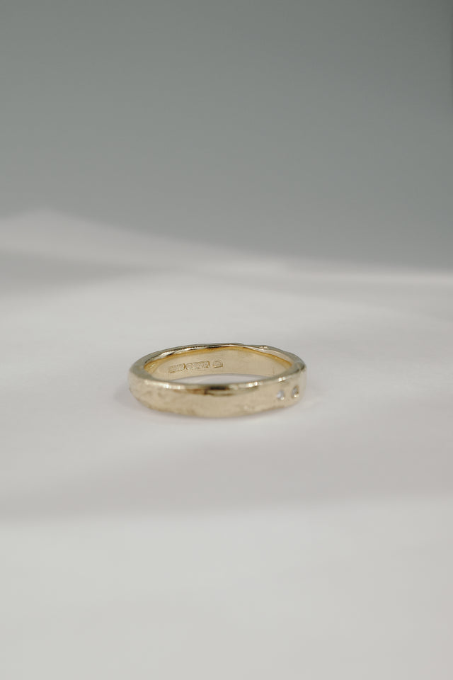 Eroded Flat Band in Fairmined Gold with Salt + Pepper Diamonds