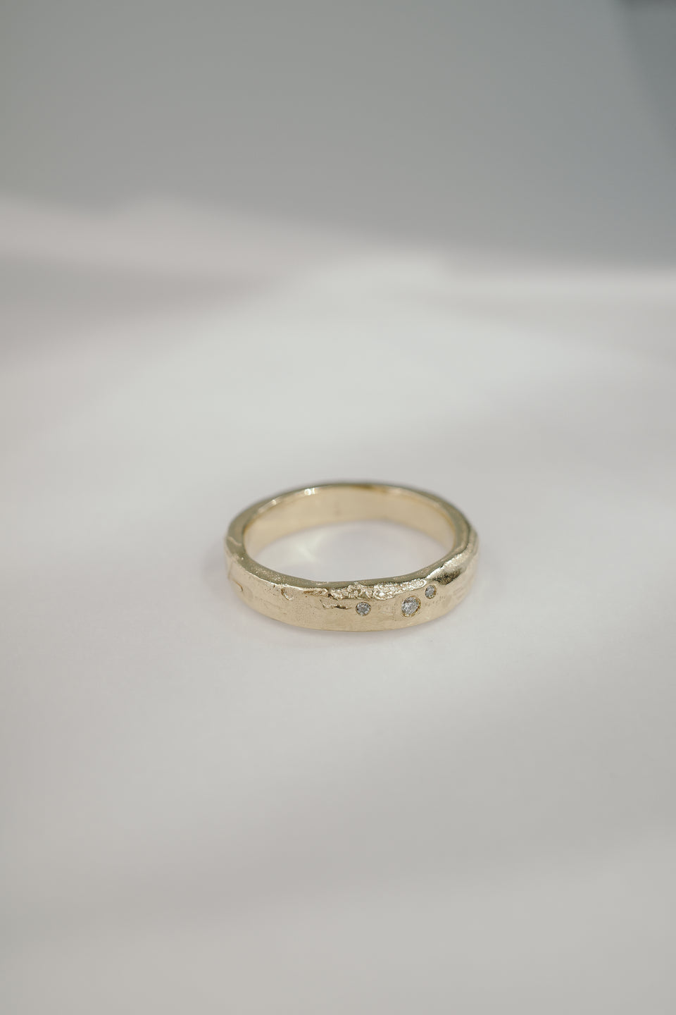 Eroded Flat Band in Fairmined Gold with Salt + Pepper Diamonds